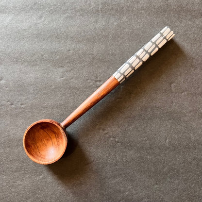 rectangles handle wooden spoon on a gray background