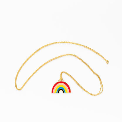 rainbow pendant on gold chain on white background
