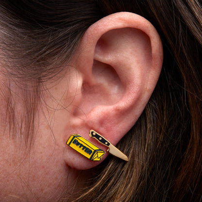 close-up of persons ear with both earrings on.