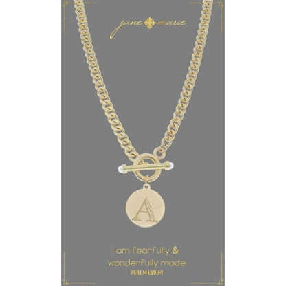 "a" stamped letter necklace on a gray display card on a white background