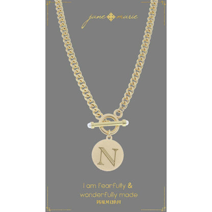 "n" stamped letter necklace on a gray display card on a white background