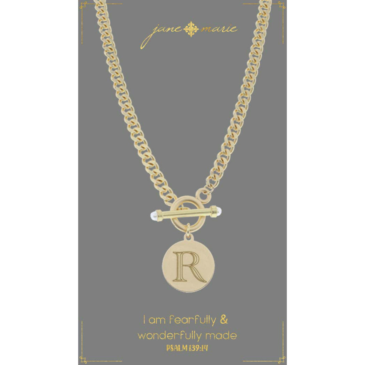 "r" stamped letter necklace on a gray display card on a white background