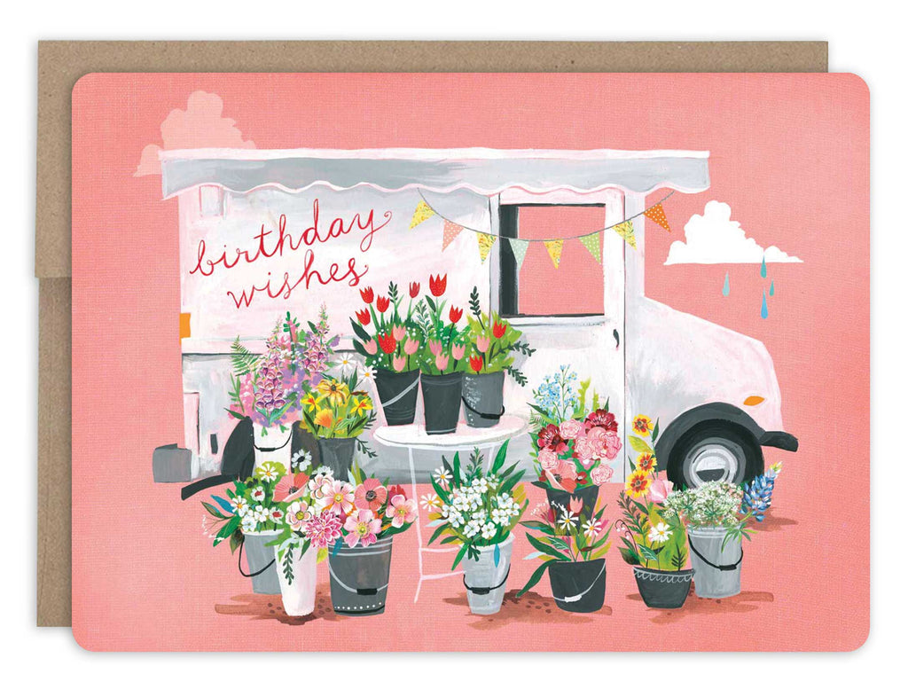 front of card is pink with a white delivery van and buckets filled with flowers and text listed in description with a natural envelope behind it on a white background