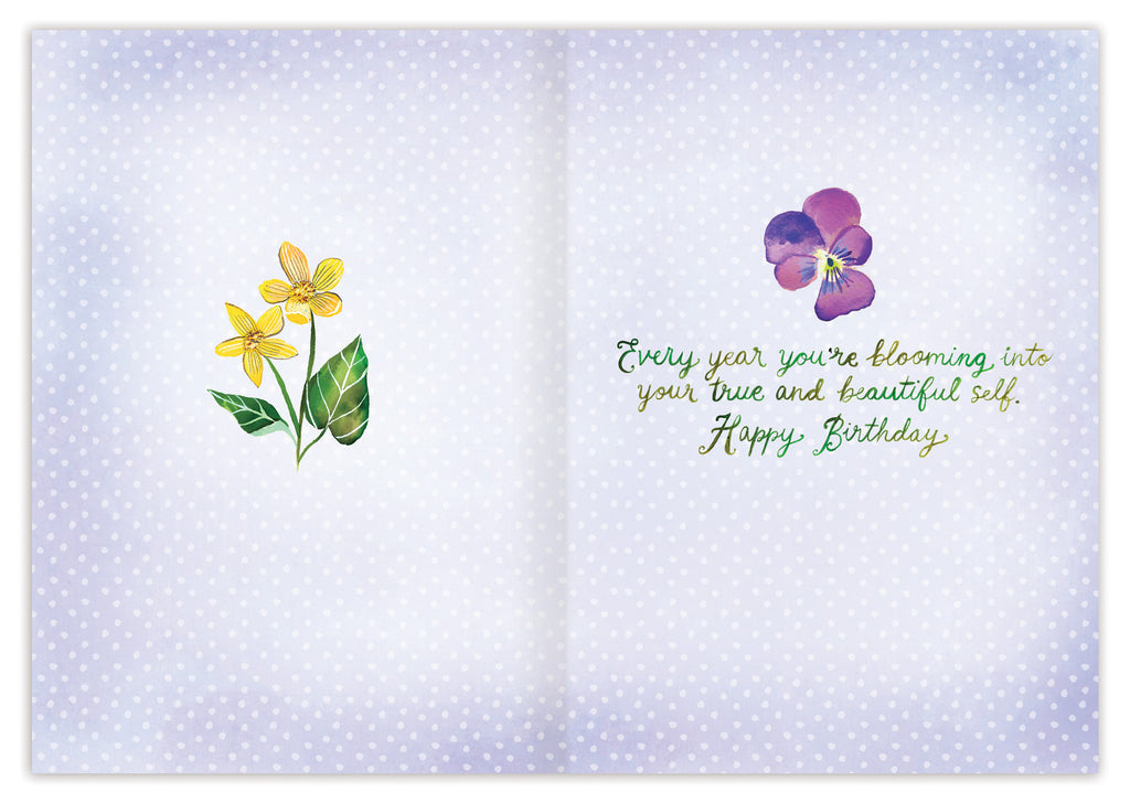 inside of card is blue with yellow flowers on one side a purple one on the other with green text listed in the description