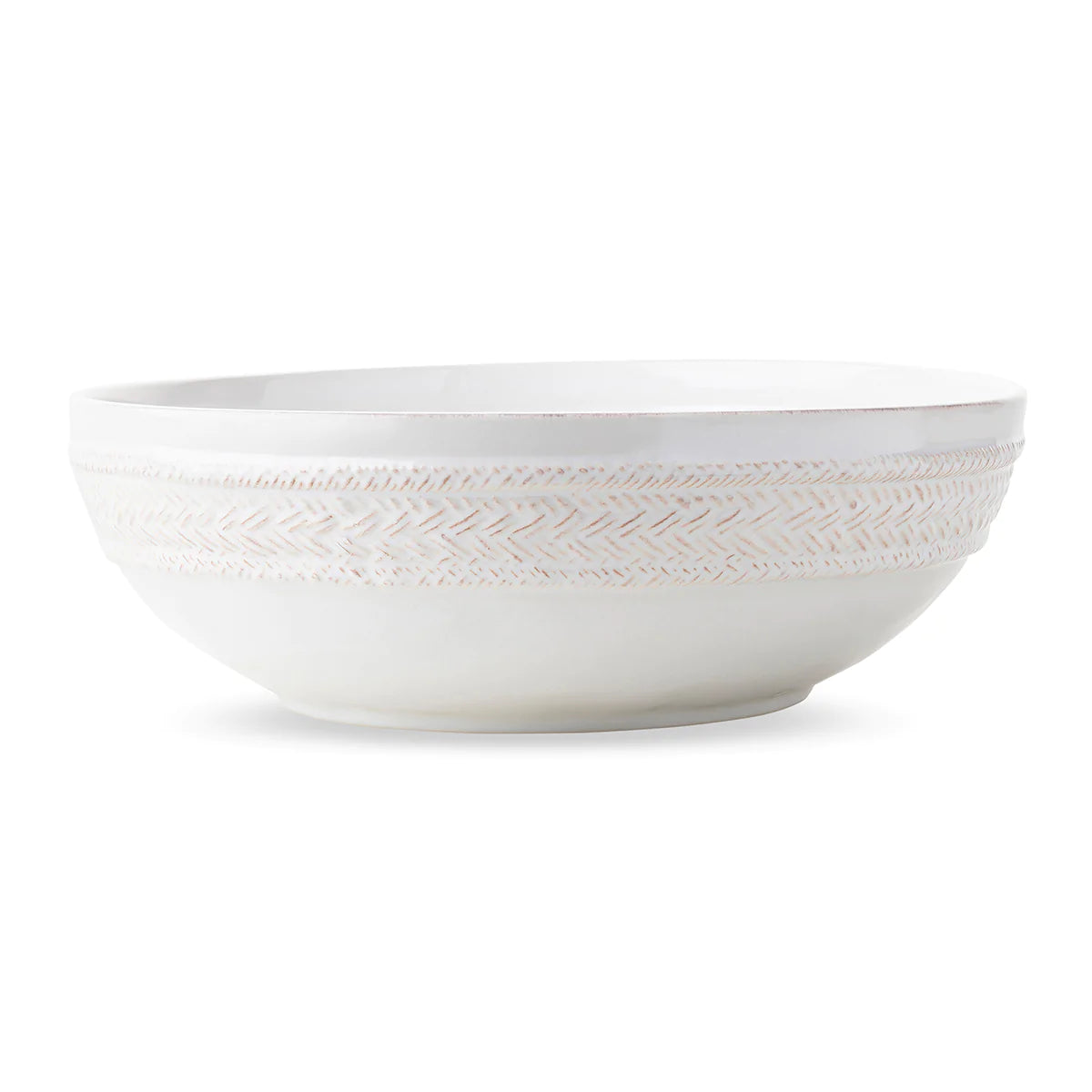 white ceramic bowl with basket weave design along the outer edge.