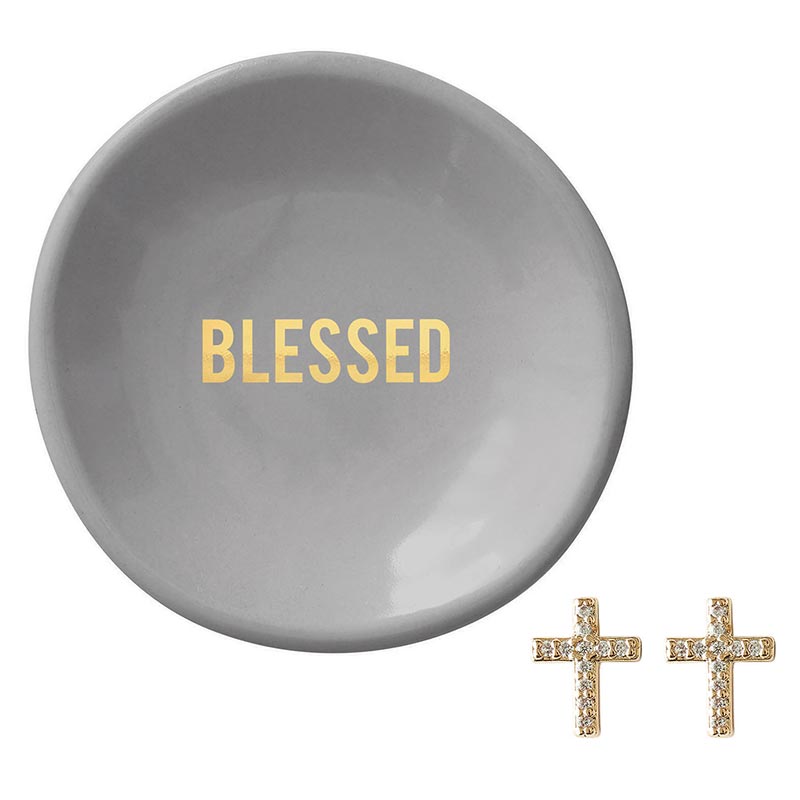 blessed ceramic dish and cross earrings on a white background