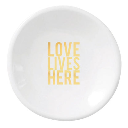love lives here white ceramic dish on a white background