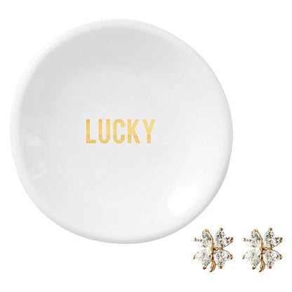 lucky white ceramic dish and clover earrings on a white background