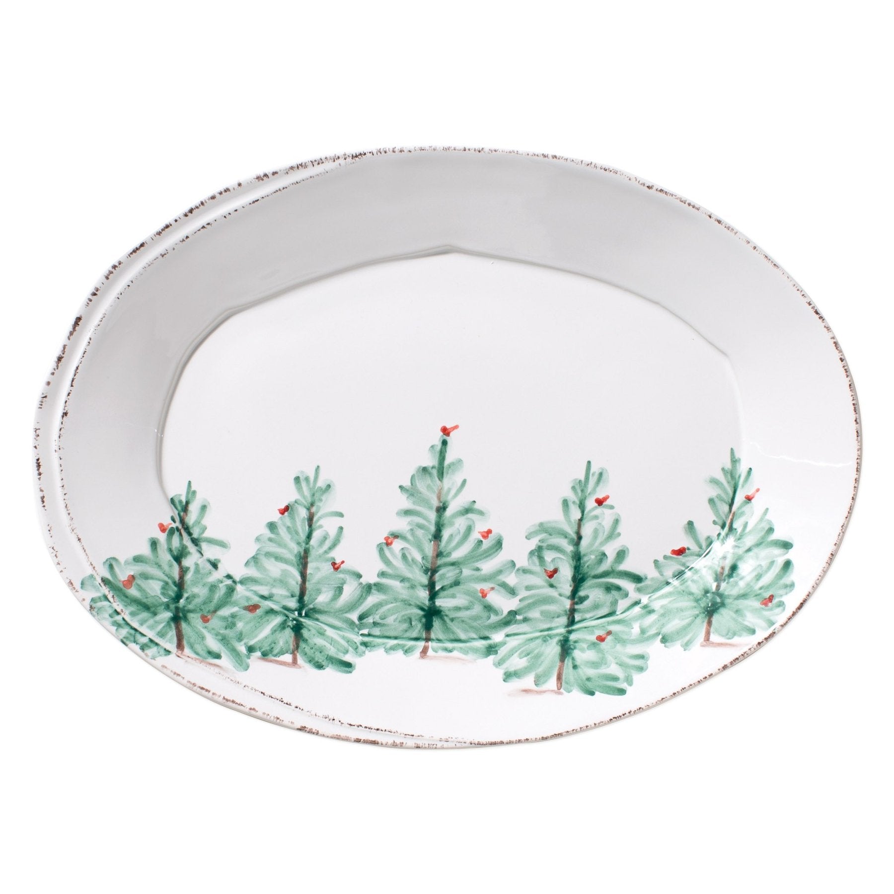 oval holiday platter with trees on white background.