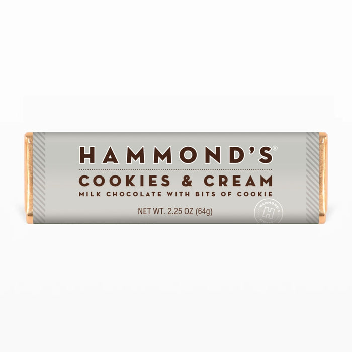 cookies and cream milk chocolate candy bar wrapped in a gray wrapper with brown lettering on a white background