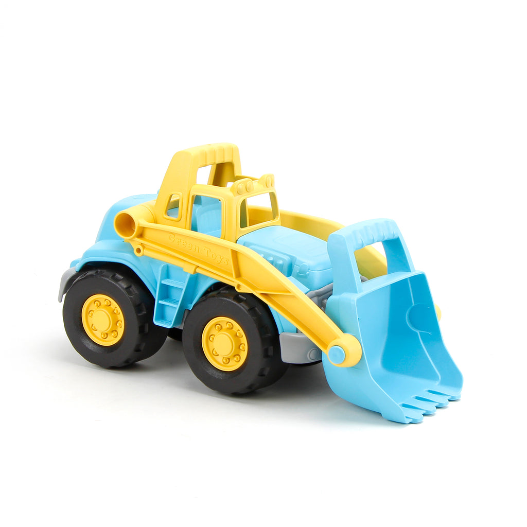 angled view of the loader truck with the bucket down on a white background
