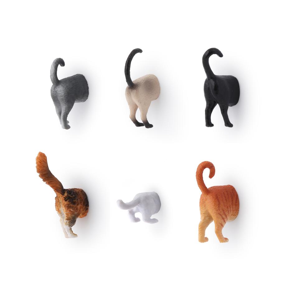 set of six cat butt magnets on a white background
