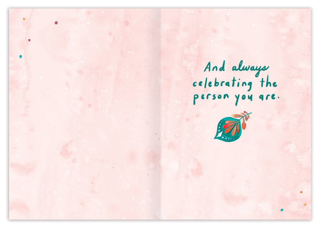 inside of card is water color pink with a turquoise feather and text listed in the description