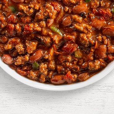 a bowl of montana creekside classic chili on a white background