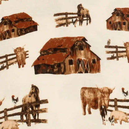 close-up of ivory fabric with all-over pattern of barns, horses, and cows.