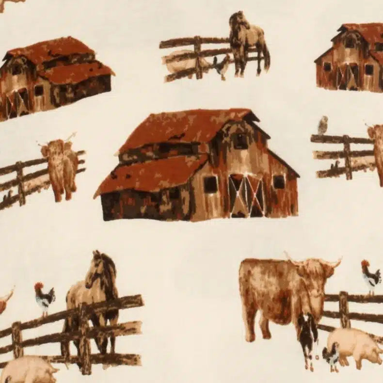 close-up of cream fabric with all-over pattern of barns, horses, and cows.