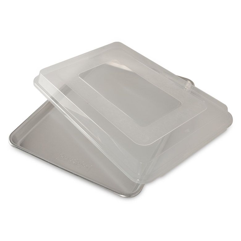 half sheet pan with lid set askew.