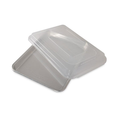 quarter sheet pan with lid set askew.