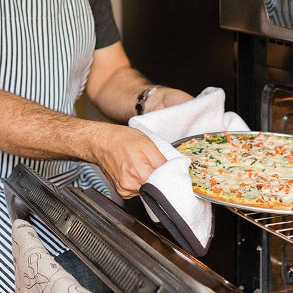 person using oven towel to remove pizza from oven.