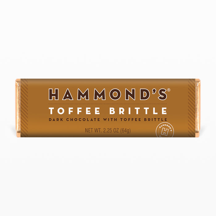 natural toffee brittle dark chocolate candy bar in a brown wrapper on a white background 