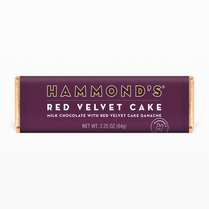 red velvet cake milk chocolate candy bar wrapped in purple packaging displayed on a white background