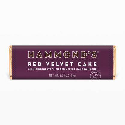 red velvet cake milk chocolate candy bar wrapped in purple packaging displayed on a white background
