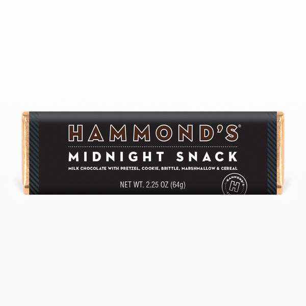 the midnight snack milk chocolate candy bar on a white background