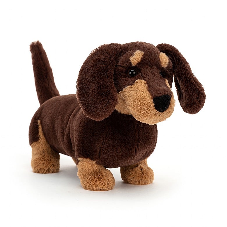 front angled view of otto sausage dog plush toy is brown and tan displayed against a white background