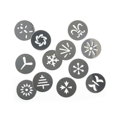 12 assorted cookie press discs on a white background.