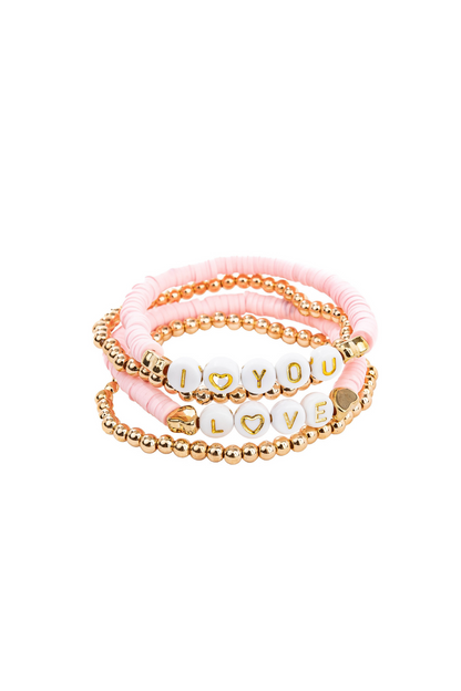 the pink love bracelets on a white background