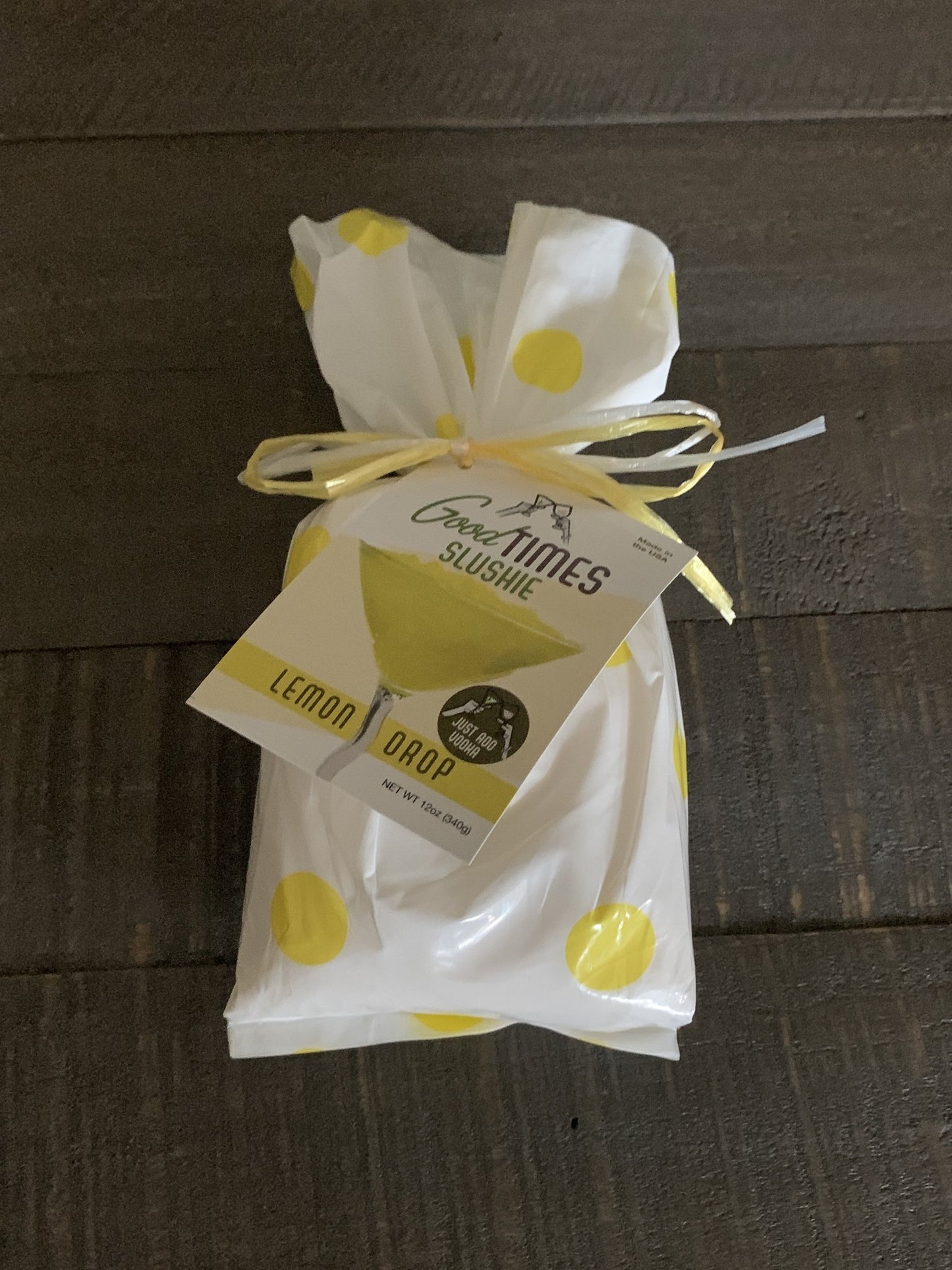 lemon drop slushie mix package on a wooden slat table