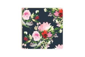 black and pink floral coaster has pink, white, and red flowers all over and displayed on a white background