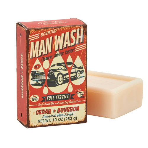 orange rectangular box of soap with bar of soap behind it on white background. box has graphic of vintage car and the text " scented man wash, cleaner, shinier, faster".