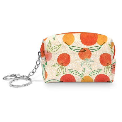 small zipper pouch with light orange background and an all-over design of oranges and leaves. pouch has 1.5 inch chain on zipper pull with key ring and claw clip attached on the end.
