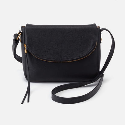 black leather bag with rounded flap and gold zipper with tassel.