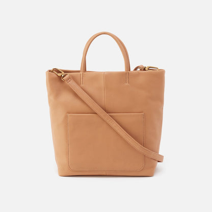 tan colored tote with handles and strap.