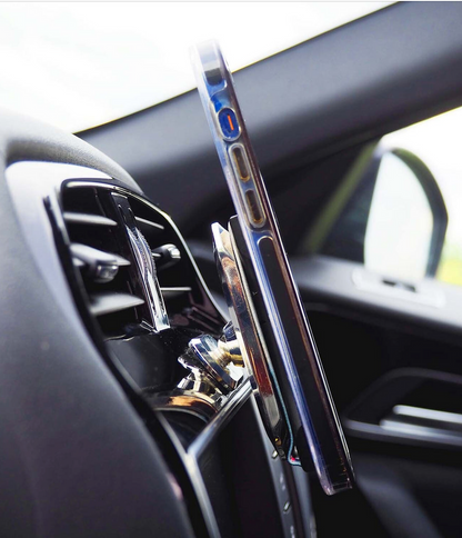 photograph of lovehandle mount attached to the dash of a car holding a phone