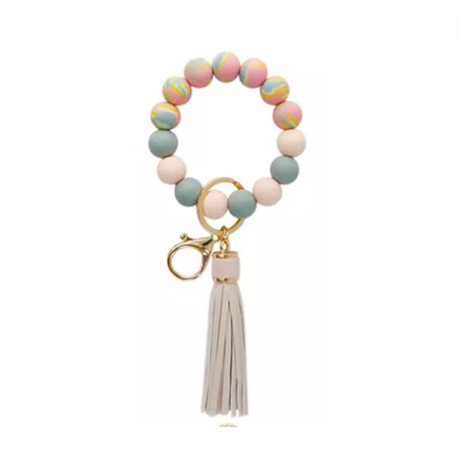 colorful silicone beaded bracelet with pink tassel.