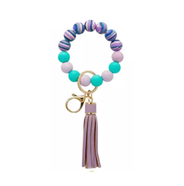 colorful silicone beaded bracelet with purple tassel.