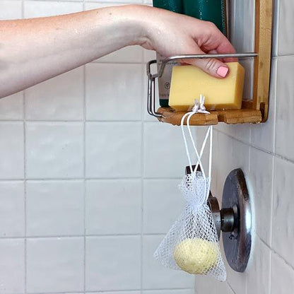 illustration of a shower burst hanging in a sachet from a shower rack