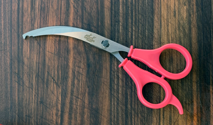 sea shrimper scissors on a wooden surface