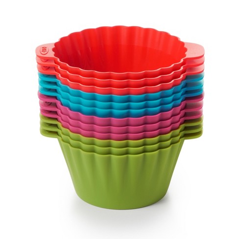 stack of silicone baking cups, 3 each of green, pink, blue, and red.