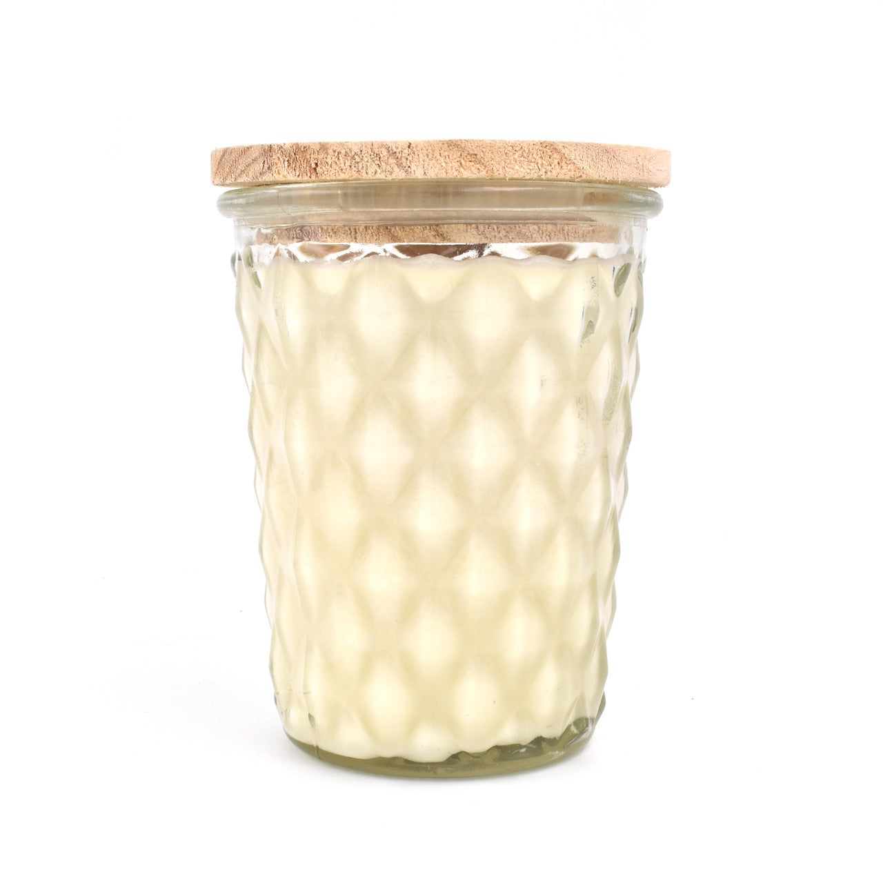 candle in glass jar with a geometric pattern and a wooden lid; the candle is made from ivory colored wax.