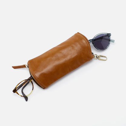 truffle spark glasses case displayed with reading glasses on one end and sunglasses at the opposite on a white background