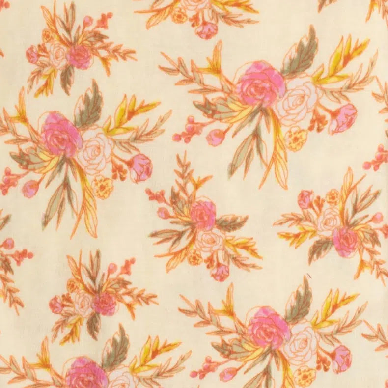 close-up of cream fabric with all-over vintage floral pattern.