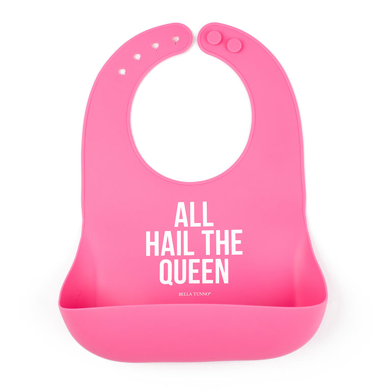 pink silicone bib with wording all hail the queen on the front on a white background
