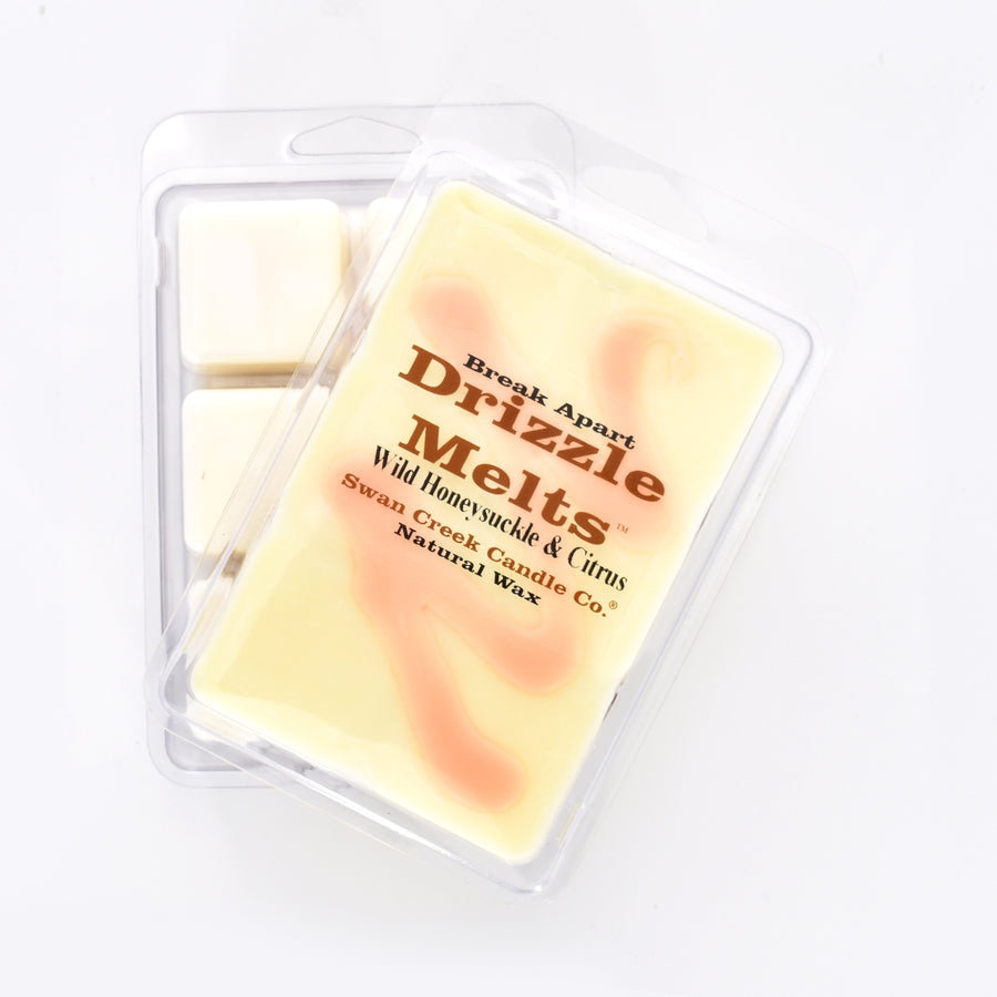 cream colored wax with blush colored swirl across the top in packaging with another package showing the bottom of the wax melts break apart design.