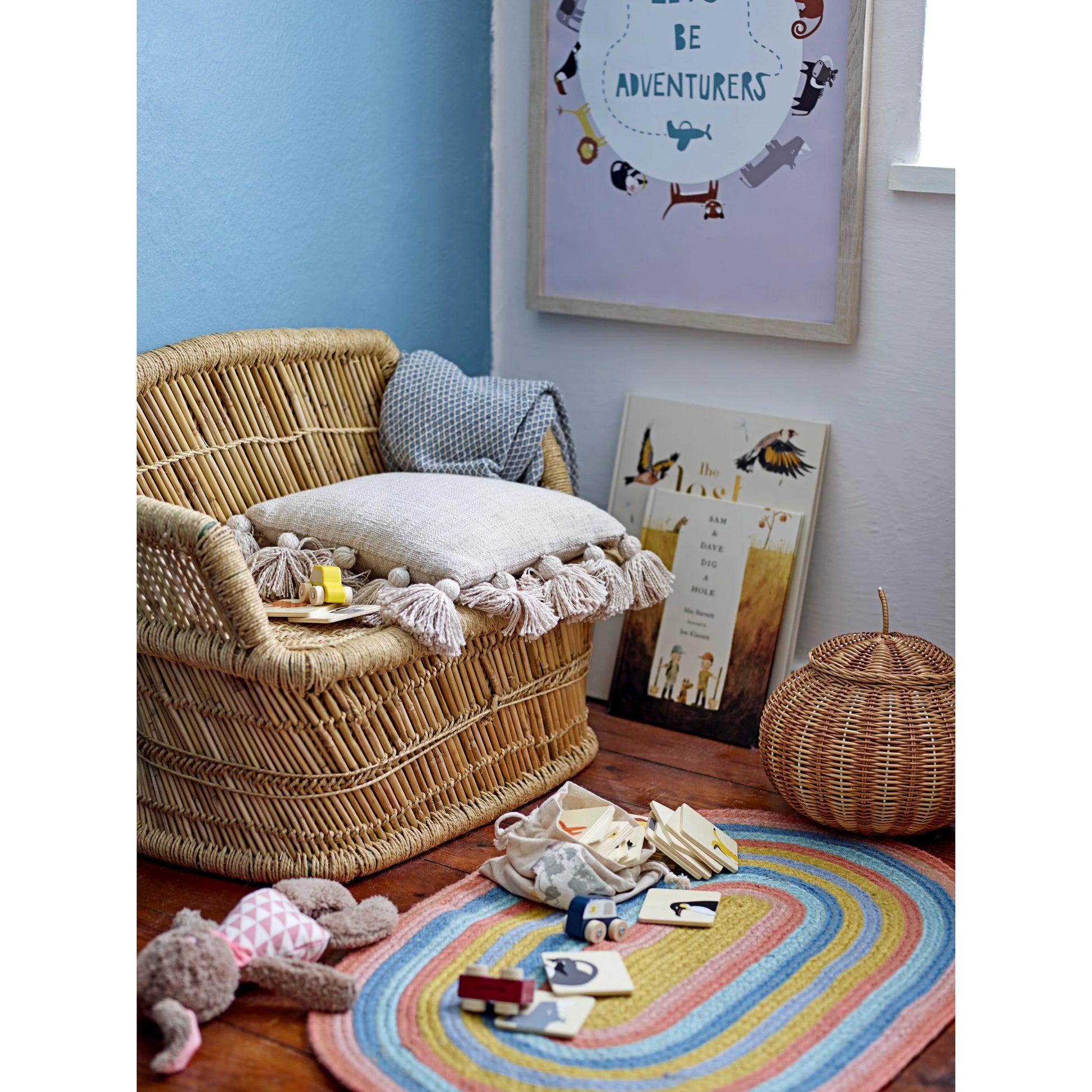 slub pillow with tassels displayed on woven twig chair in a childs room