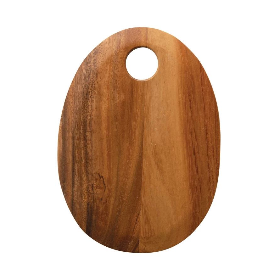 oval wooden board with circular hole in the top on a white background.