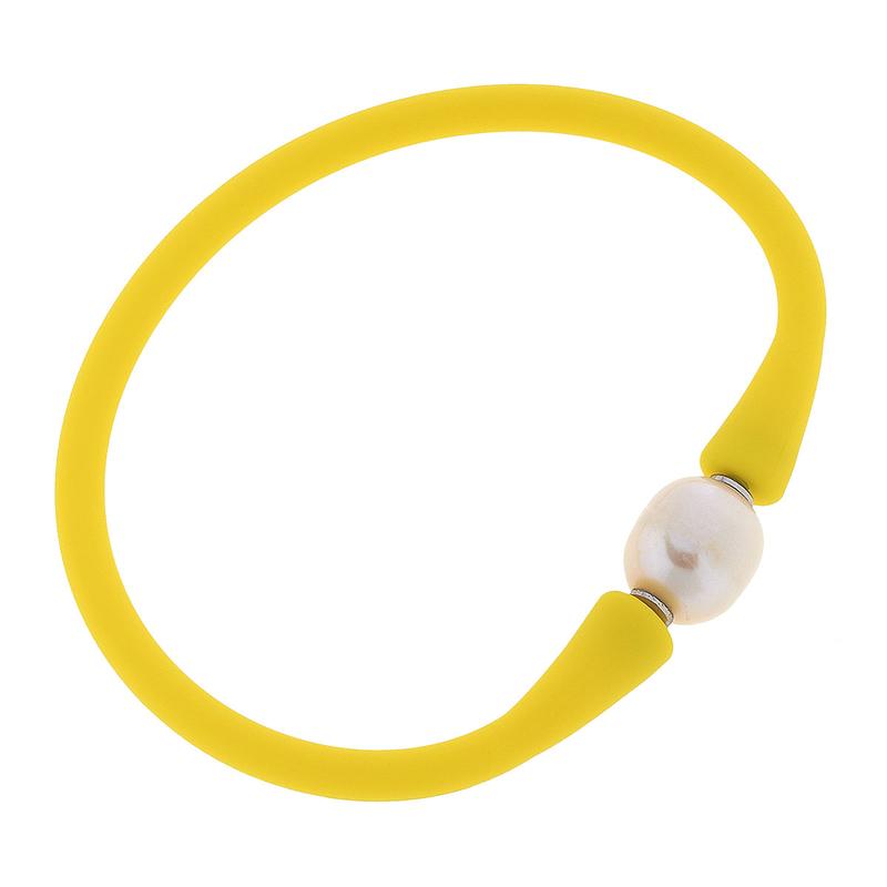 yellow bali freshwater pearl silicone bracelet on a white background